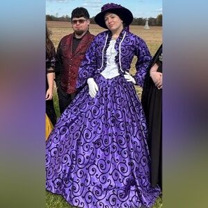 Purple dress w/ hat/corset/hoop skirt included. I’m a size 32 waist/36C for ref